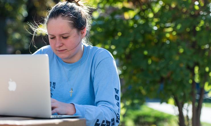 Student with Laptop outside