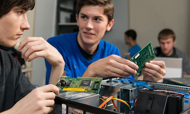 boys holding computer grids